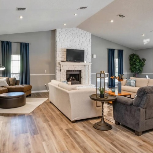 a large living room with a fireplace