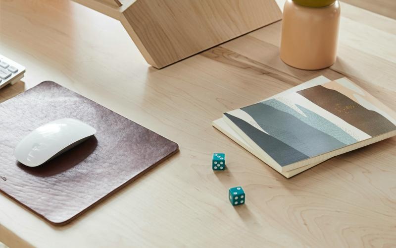 a laptop and a box on a table