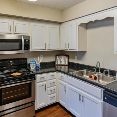 a kitchen with white cabinets
