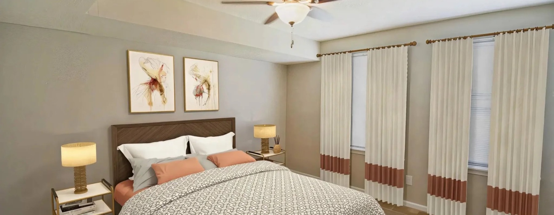 a bedroom with a bed and two nightstands